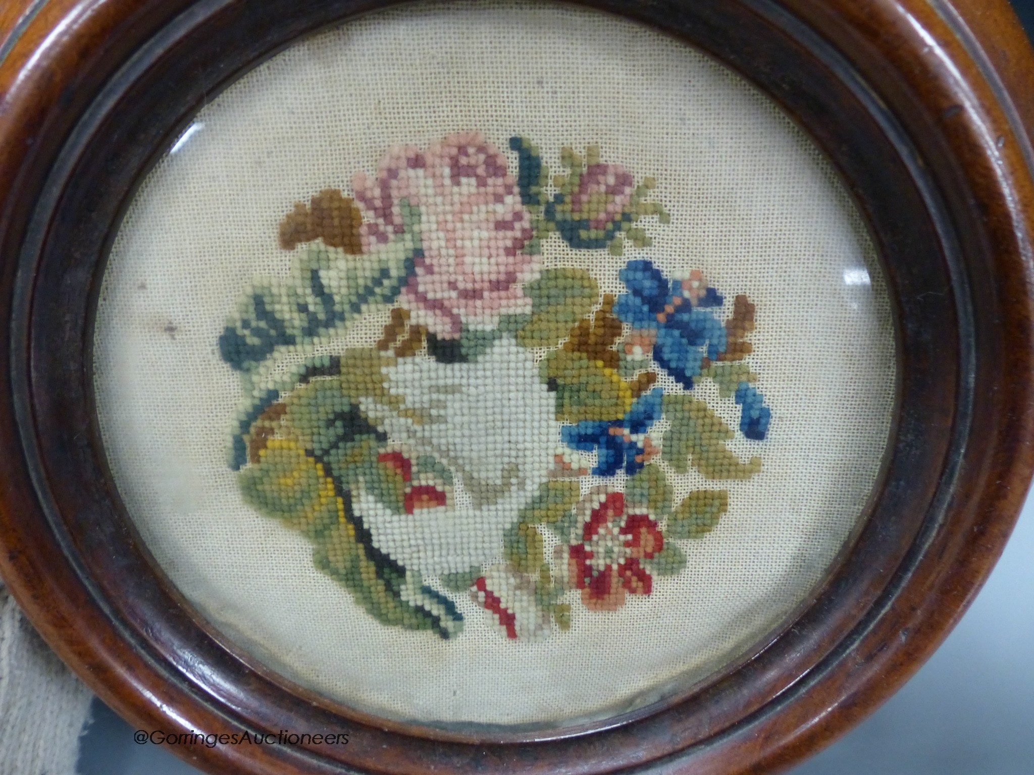 A petit point Victorian mahogany framed coaster, 23cm